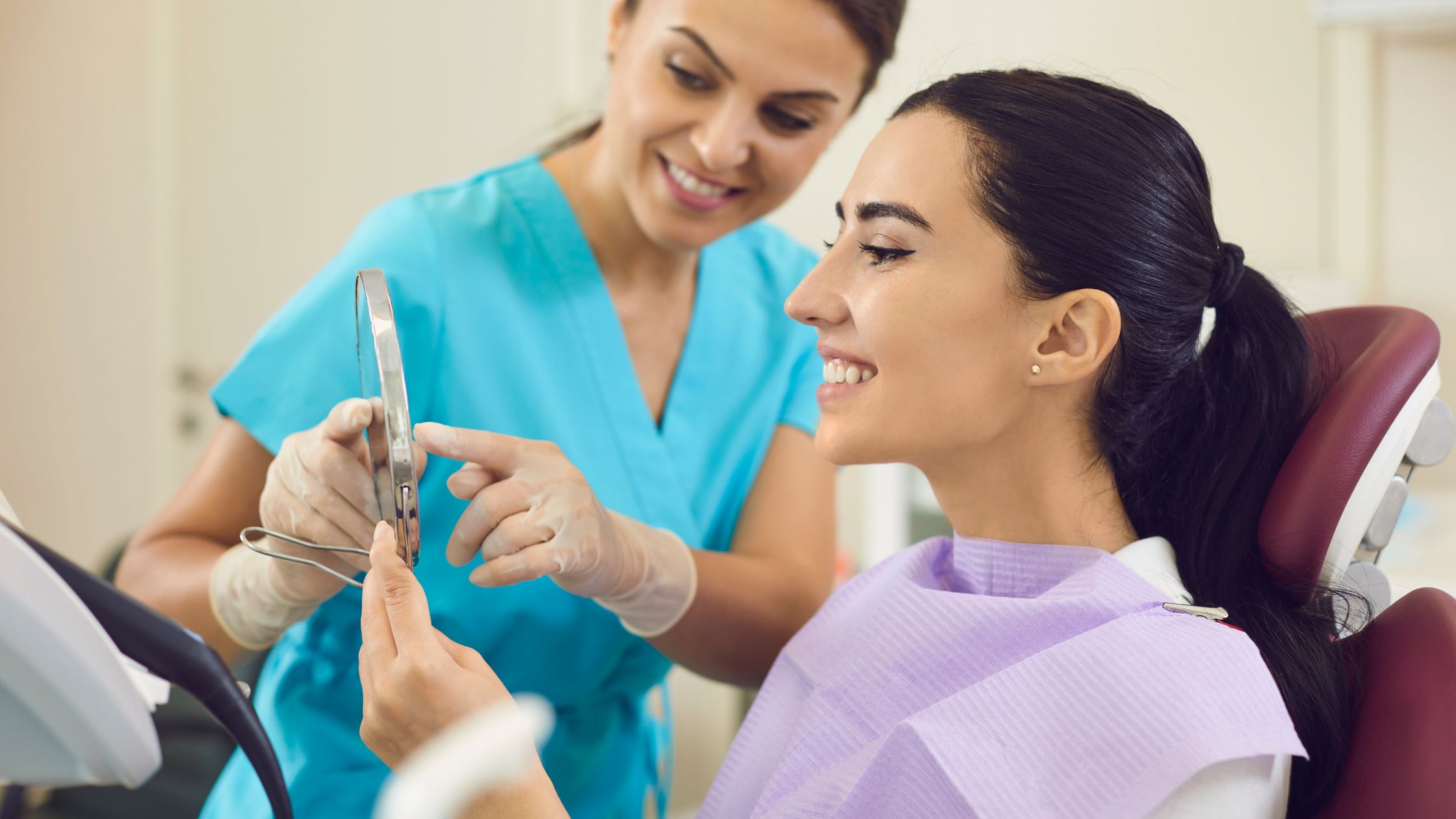 Smiling dentist with happy patient